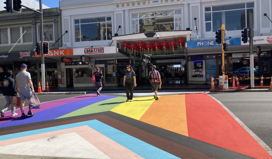 Pedestrians crossing the rainbow crossing on Karangahape Road (K Road), Auckland