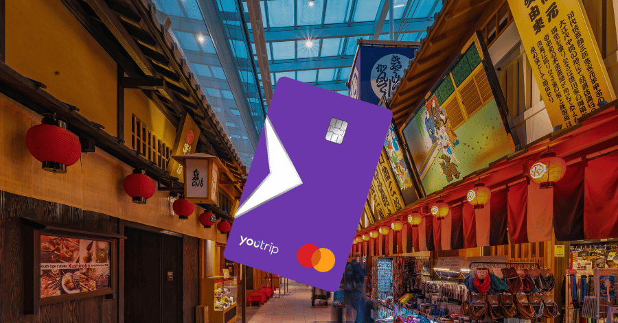 YouTrip Mastercard graphic over a lantern-lined traditional Japanese shopping street