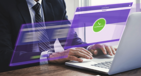 Businessman at a laptop with an overlaid graphic of a successful online bank transfer