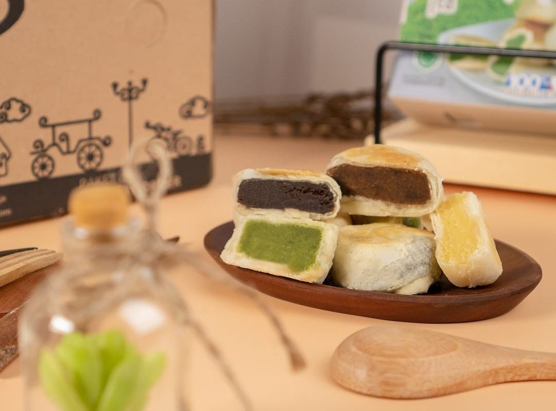 Bakpia pastries cut open to show their sweet mung-bean and other fillings