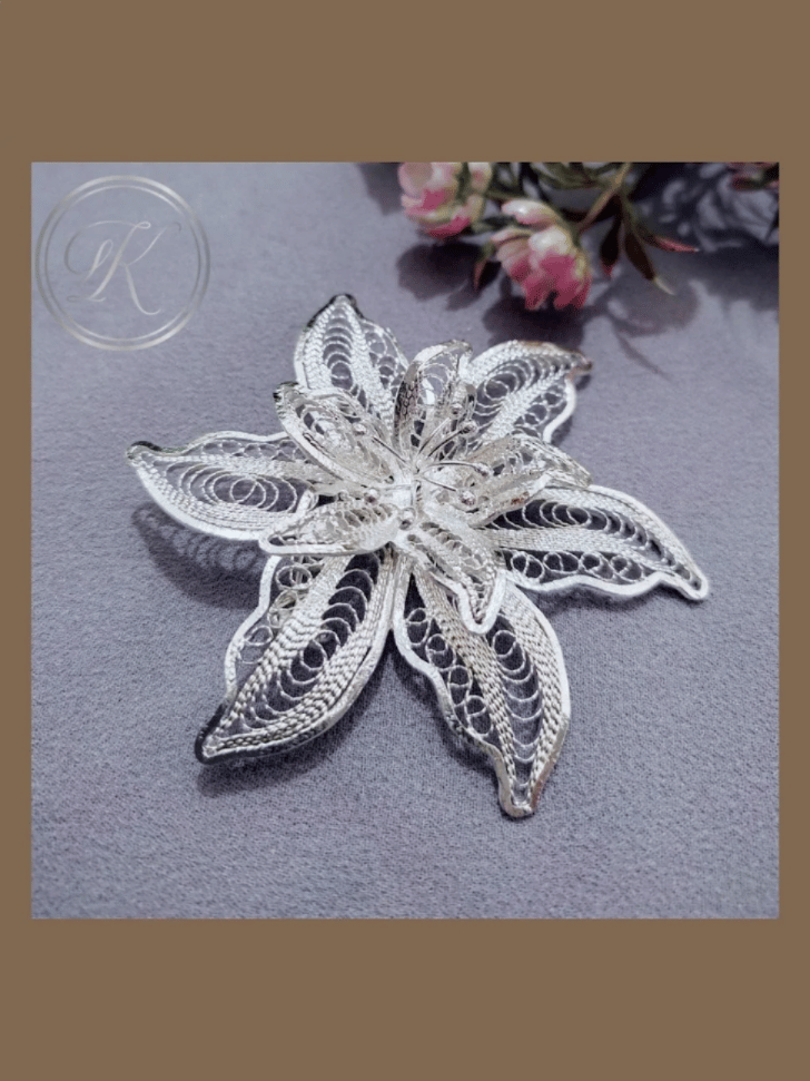 A delicate handcrafted silver filigree flower from Yogyakarta's Kotagede district