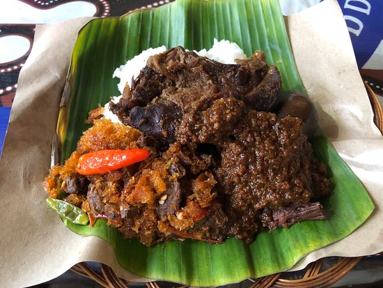 A banana-leaf plate of gudeg, Yogyakarta's sweet jackfruit stew, with rice and egg