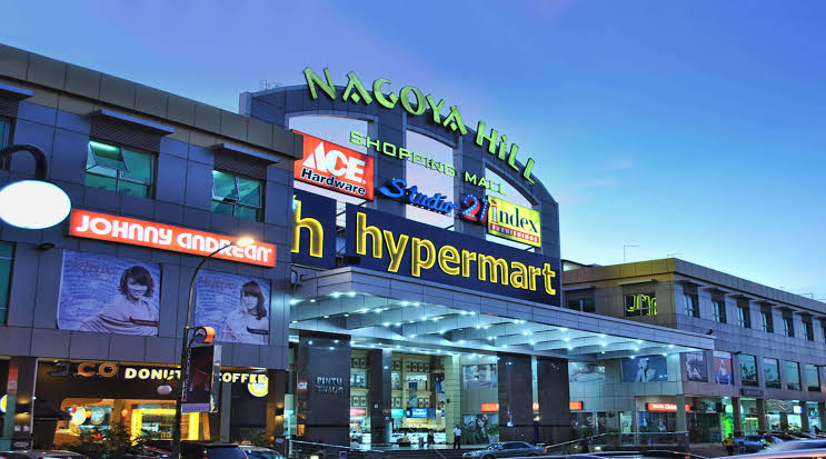 The lit night exterior of Nagoya Hill Shopping Mall, Batam