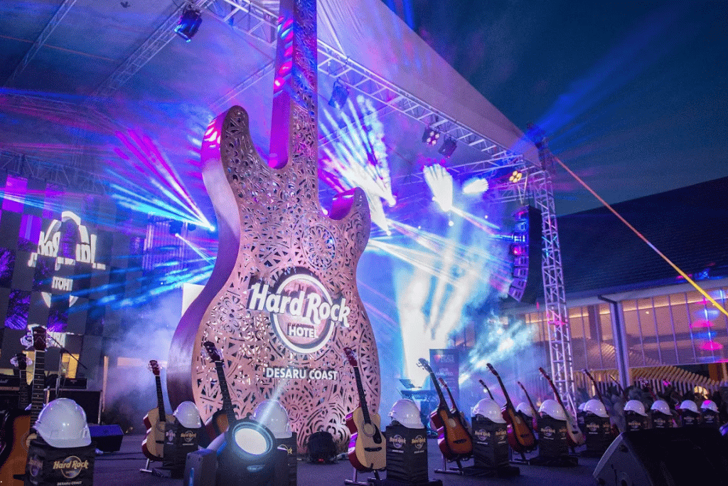 Illuminated giant guitar sculpture branded Hard Rock Hotel Desaru Coast under stage lighting
