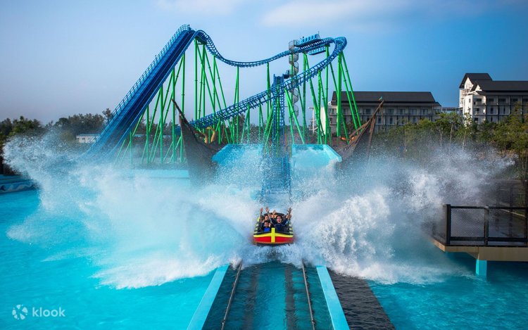 Riders splashing down a water coaster into a pool at Desaru Coast Adventure Waterpark