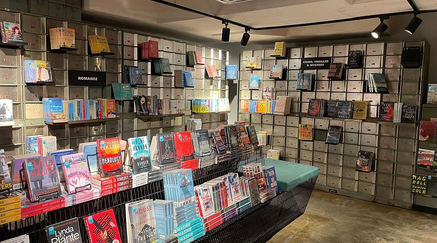 Books shelved against walls of old bank safe-deposit boxes inside BookXcess Ipoh