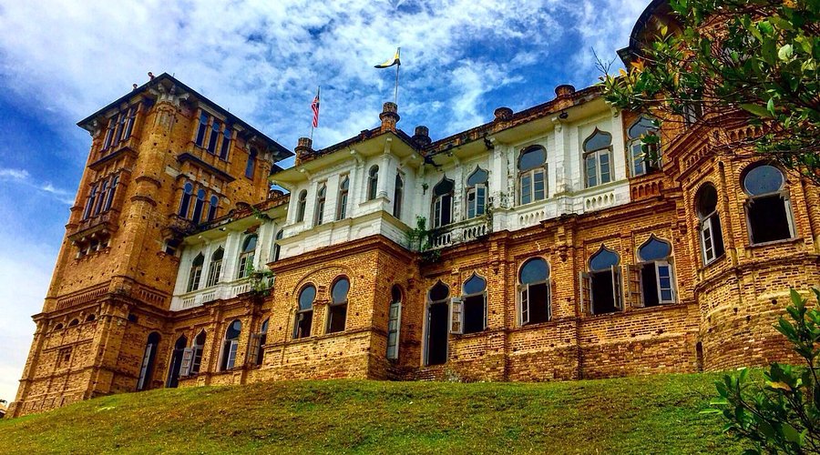 Kellie's Castle, an unfinished brick-and-white mansion on a grassy rise near Ipoh