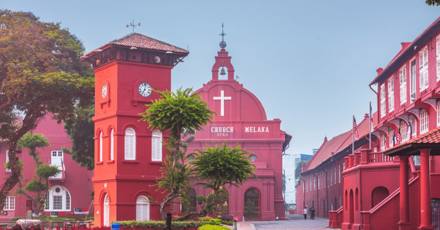 The red Stadthuys building and Christ Church around Malacca's Dutch Square by day