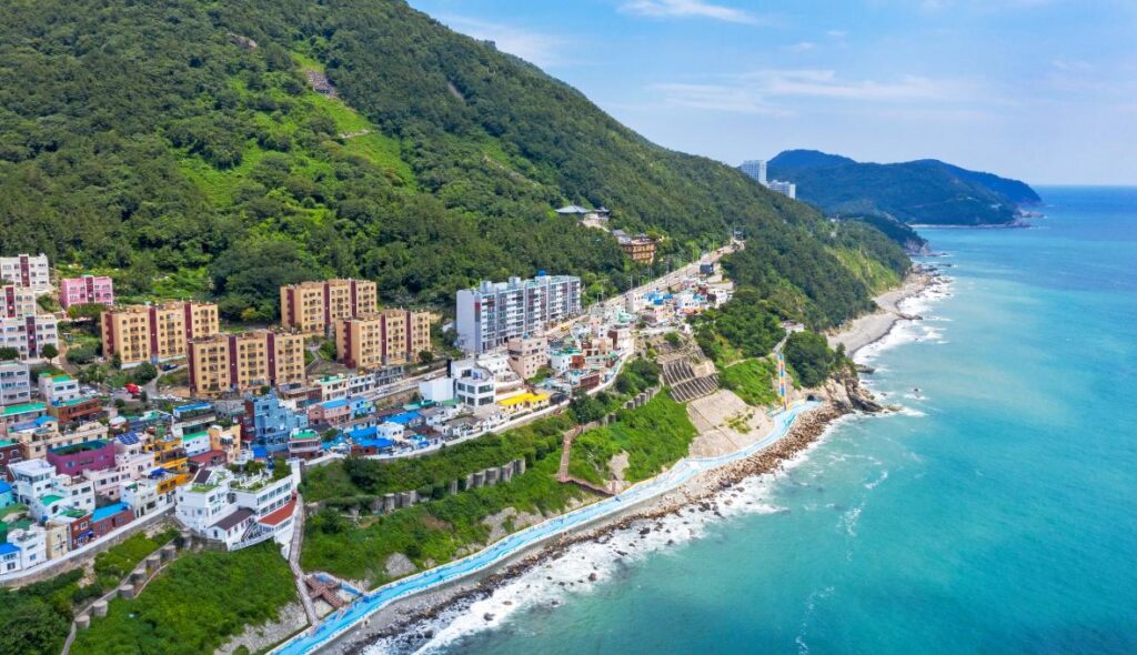 Hillside houses above a turquoise coastline at Huinnyeoul Culture Village, Yeongdo Island
