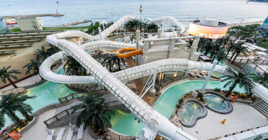 Aerial view of Club D Oasis water park slides and pools beside the sea