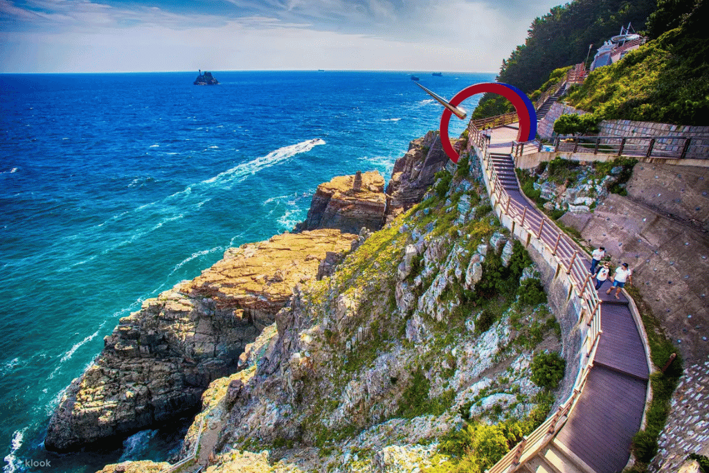 Cliffside path above turquoise sea at Taejongdae on Yeongdo Island