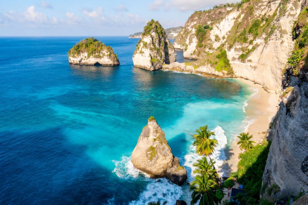 White-sand cove with limestone sea stacks and turquoise water at Diamond Beach