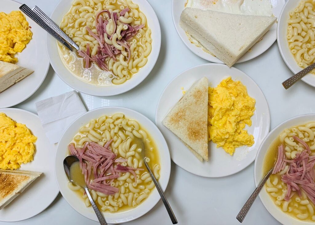 A cha chaan teng spread of macaroni-and-ham soup, scrambled eggs and buttered toast