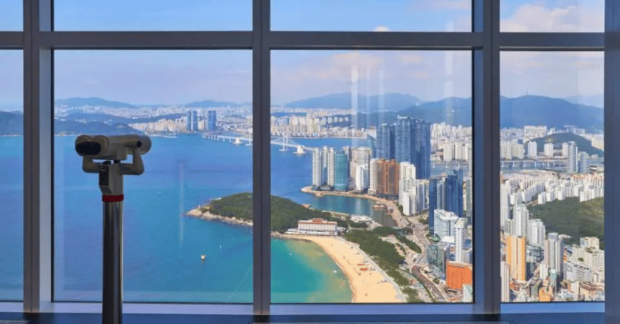 Viewing telescope and window overlooking Haeundae Beach from Busan X the Sky