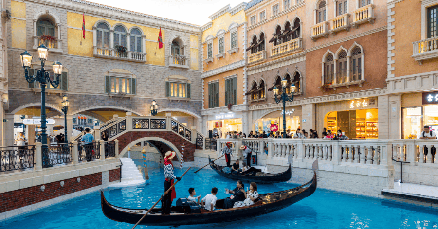 A gondola on the indoor canal beneath a painted sky at the Venetian Macao on the Cotai Strip