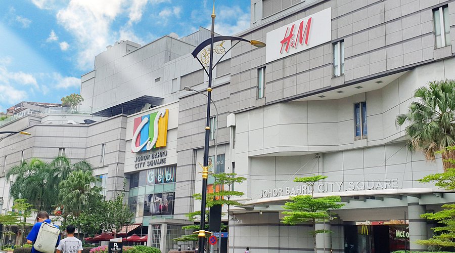 Johor Bahru City Square mall exterior with H&M signage and street palms