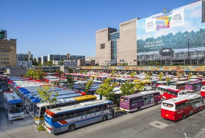 Rows of buses parked at a large Korean intercity bus terminal