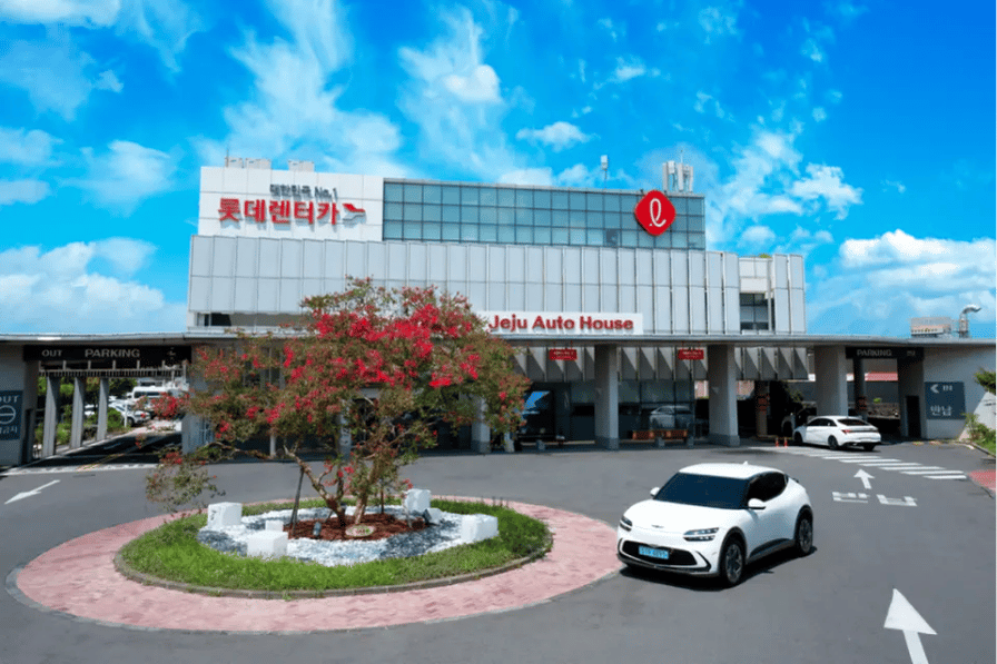 A Lotte Rent-a-Car rental branch with a car parked outside