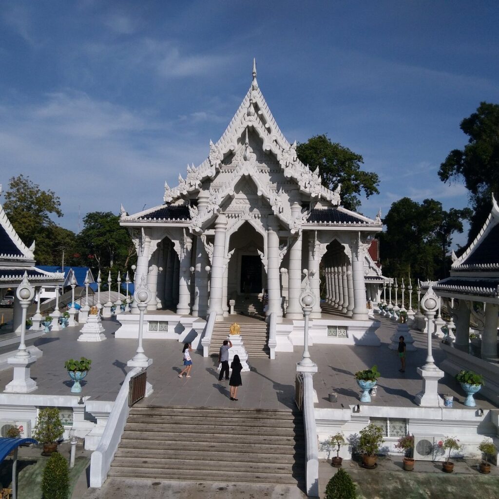 The white ornate hall and steps of Wat Kaew Korawaram temple in Krabi Town