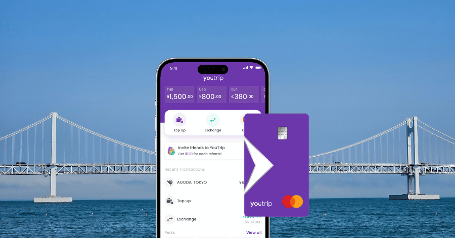 The YouTrip app and Mastercard shown against Busan's Gwangan Bridge