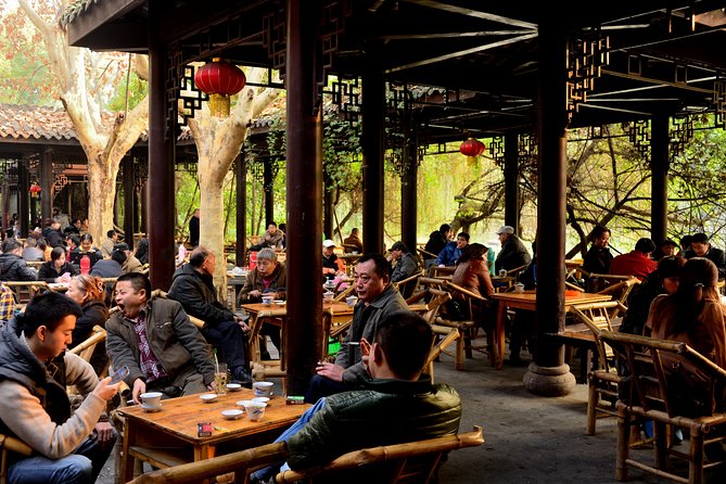 Locals drinking tea under a traditional pavilion at a People's Park teahouse, Chengdu