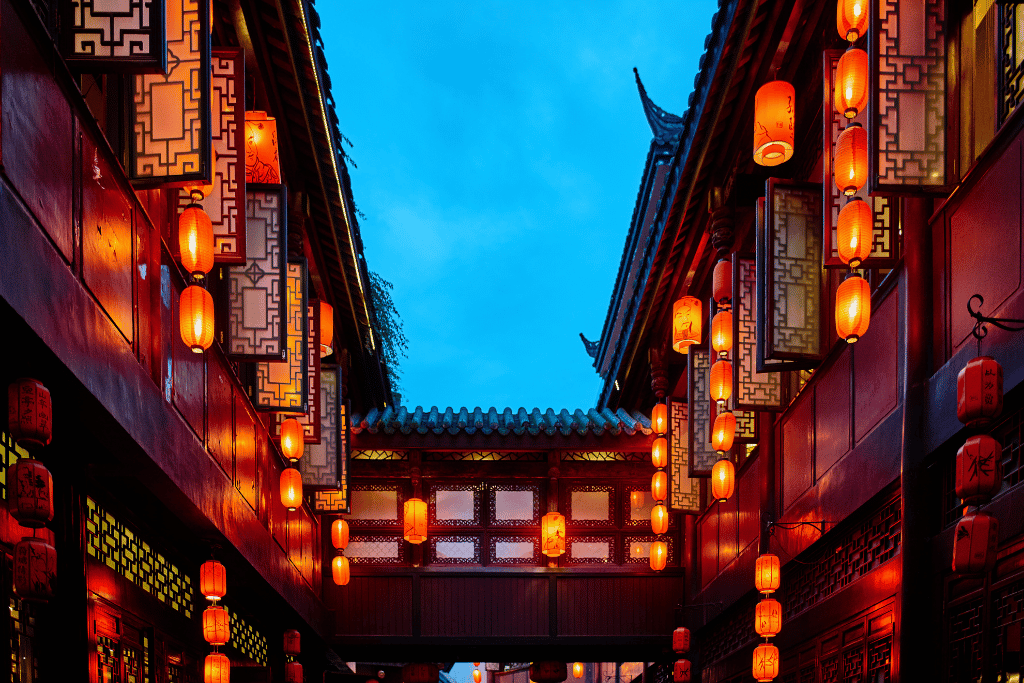 Red lanterns and traditional buildings along Jinli Ancient Street at dusk, Chengdu