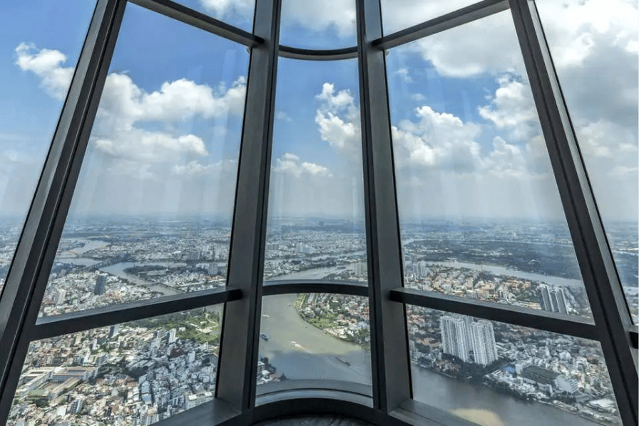 Panoramic city view through the angled windows of the Landmark 81 SkyView observatory