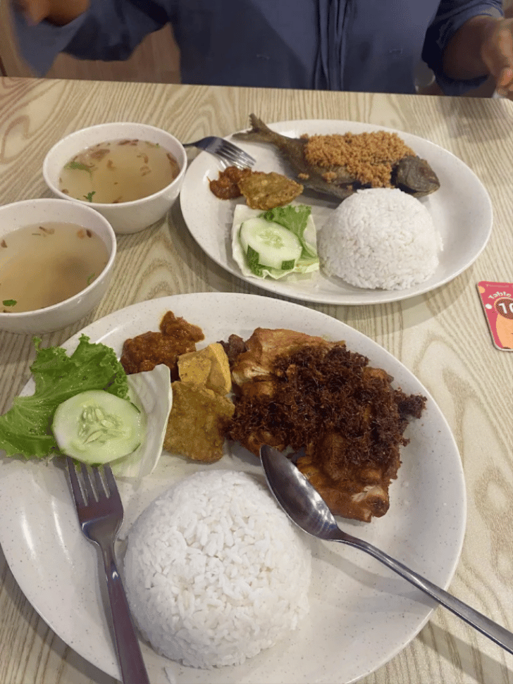 Ayam penyet plates with fried chicken, rice, sambal and soup at Penyet Express