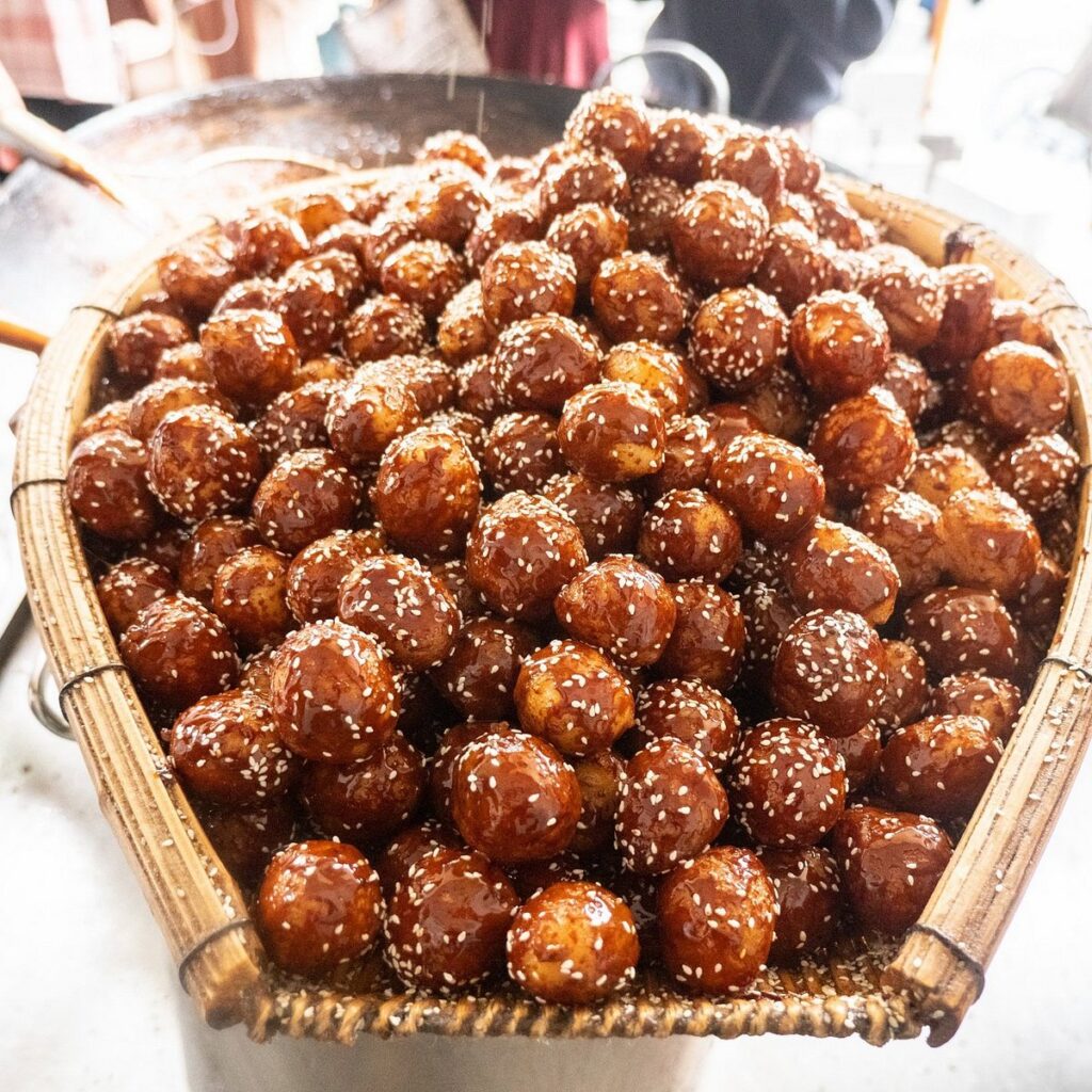 An array of Chengdu street snacks at a food stall