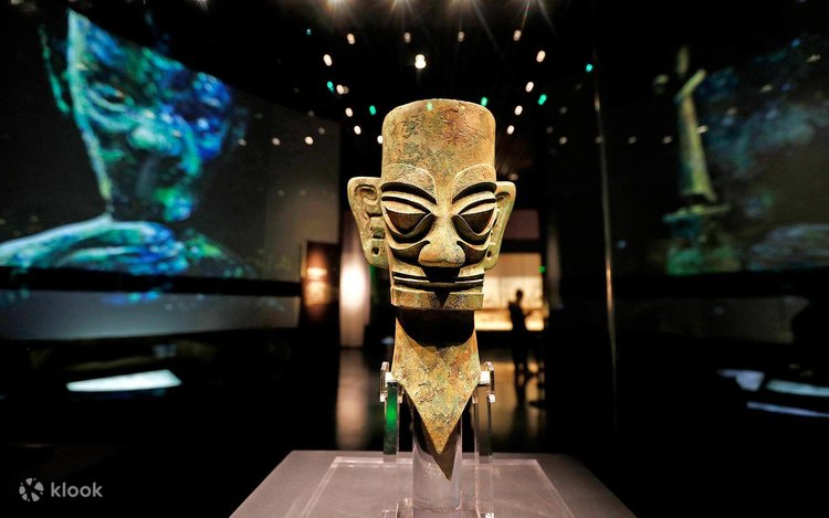 Ancient bronze mask with angular features on display at the Sanxingdui Museum near Chengdu