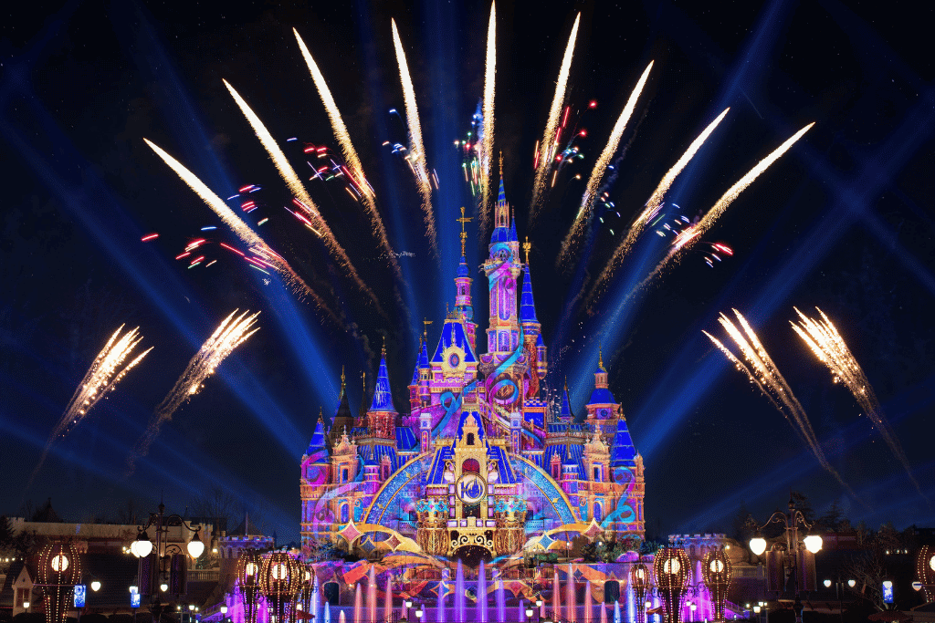 Fireworks bursting over the illuminated Enchanted Storybook Castle at Shanghai Disneyland