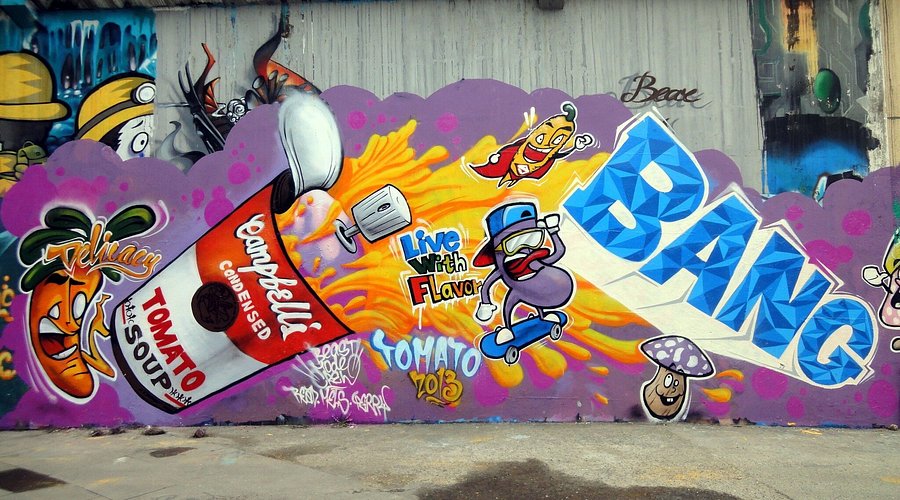 A colourful graffiti mural with cartoon characters on a wall at Shanghai's M50 art district