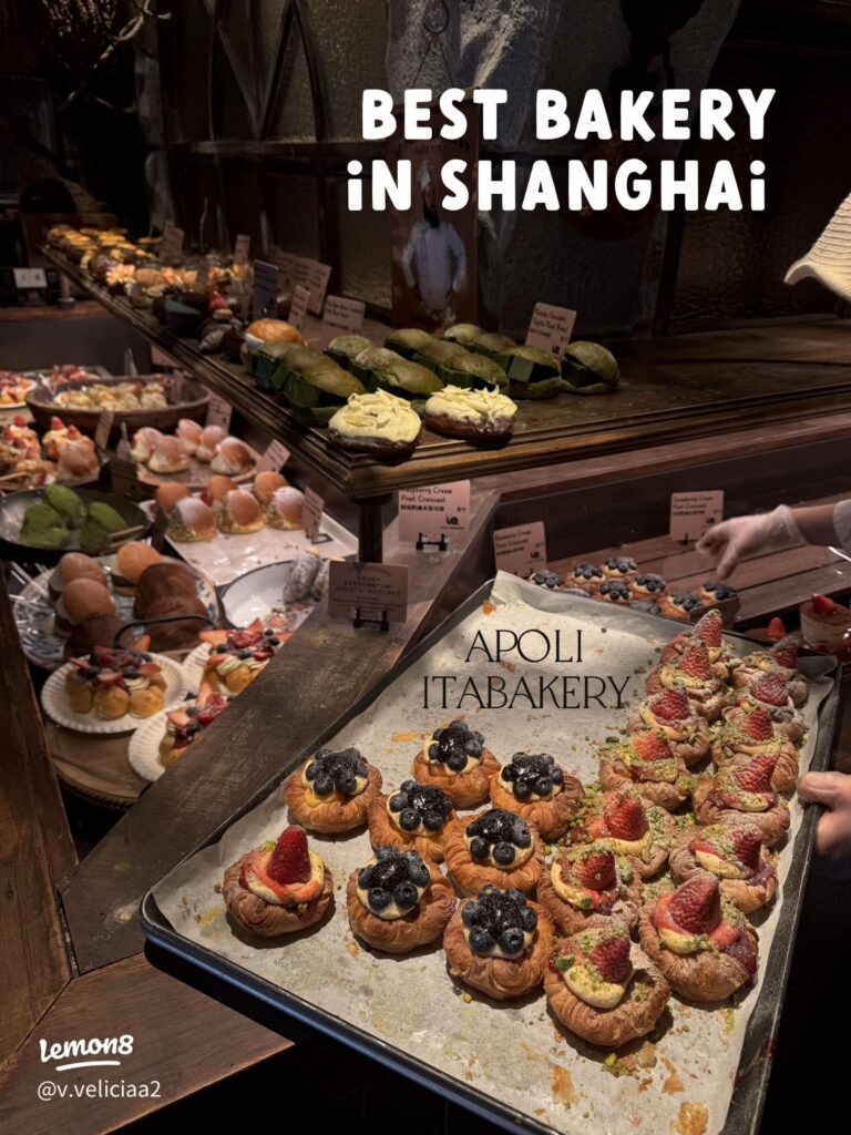 Trays of fruit-topped croissants and pastries in a Shanghai bakery display