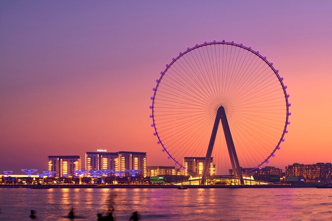 Ain Dubai, the giant observation wheel on Bluewaters Island, lit at sunset over the water