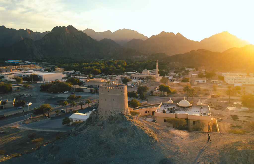 Restored mud-brick houses and a watchtower at Hatta Heritage Village in the mountains
