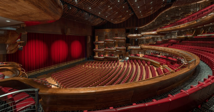 The red-seated auditorium and tiered balconies inside Dubai Opera