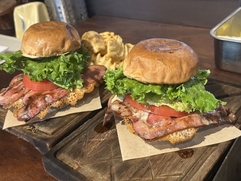 Two bacon burgers with waffle fries served at Warren's Place 2.1 Burgers and Beer