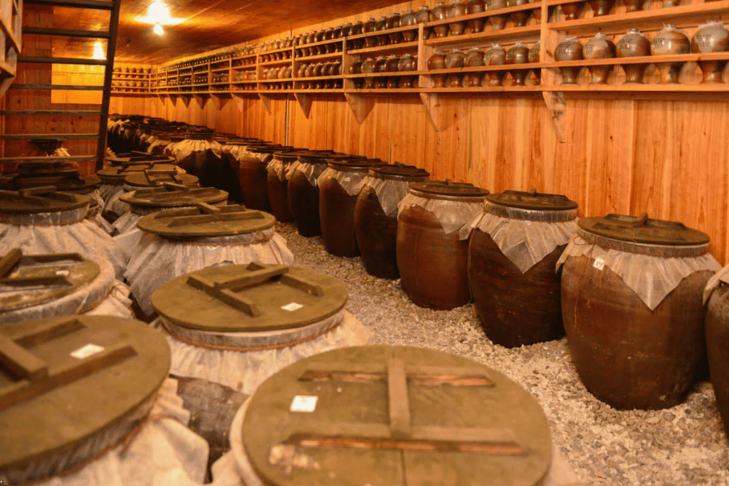 Rows of clay pots used to age awamori spirit inside an Okinawa distillery