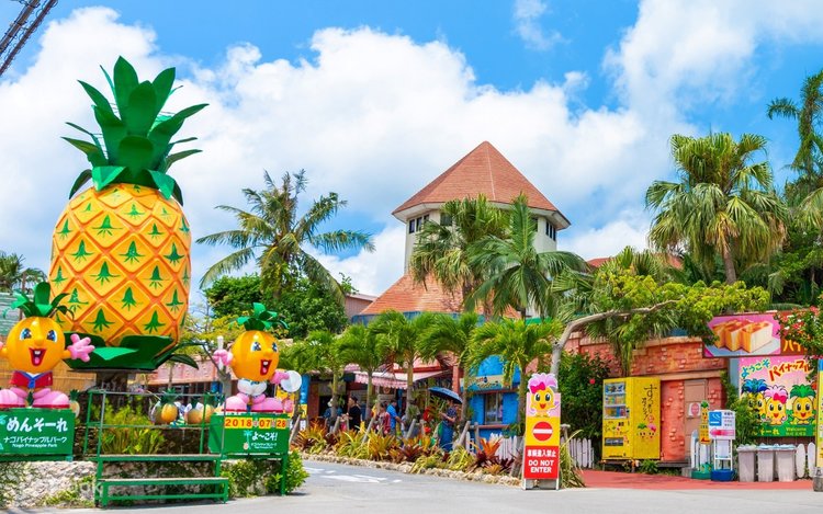 Giant pineapple-shaped statue at the entrance to Nago Pineapple Park