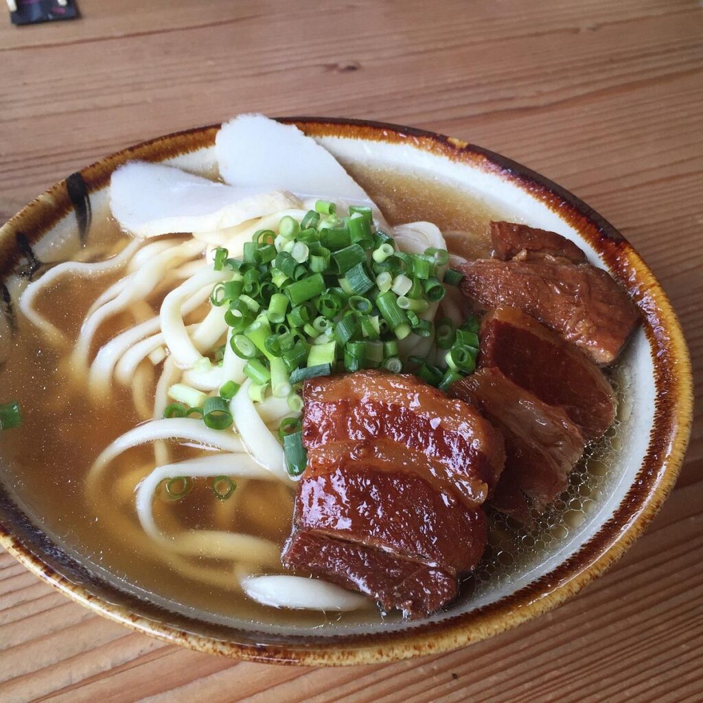 A bowl of Okinawa soba noodles topped with braised pork belly at Kishimoto Shokudo