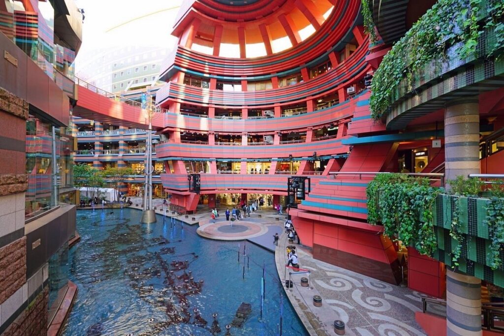 The curving red-tiered levels and central canal inside Canal City Hakata