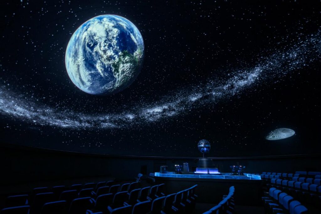 Earth and the Milky Way projected across the planetarium dome at Fukuoka City Science Museum