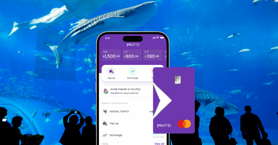 YouTrip multi-currency card and app screen shown against an aquarium backdrop
