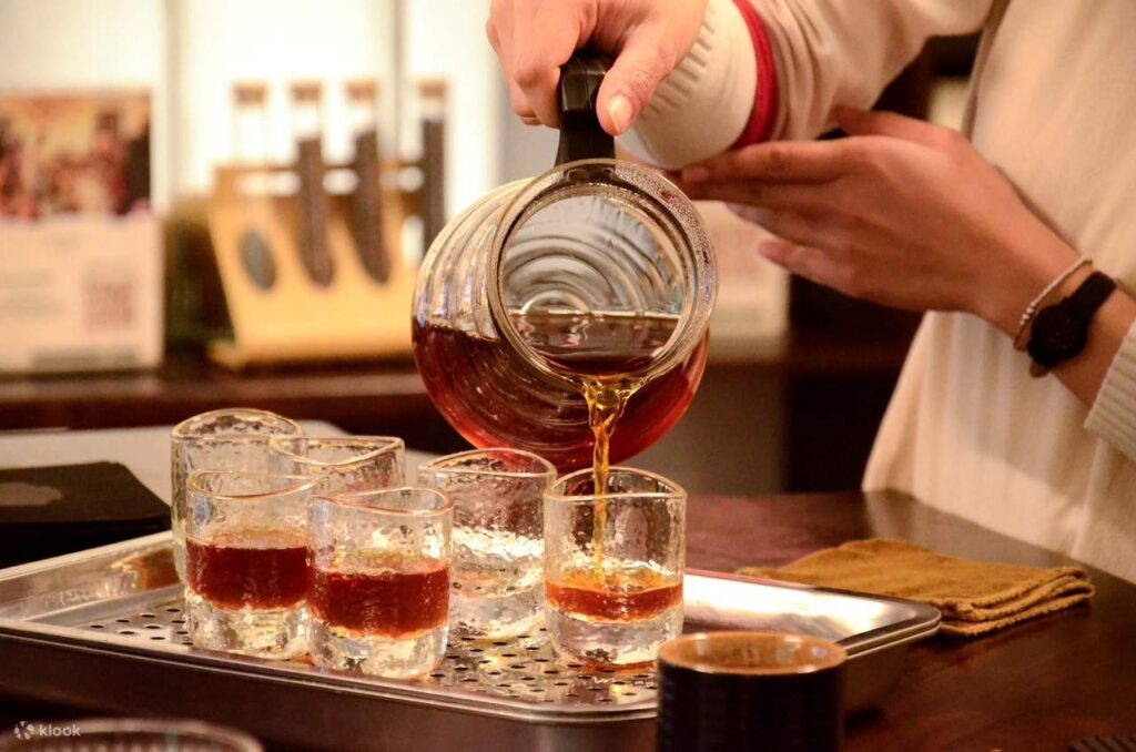 Phin filters and coffee-making equipment set out for a Vietnamese coffee workshop