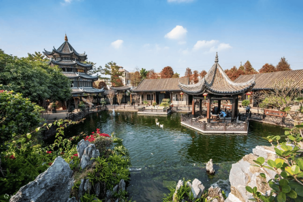 A traditional Lingnan garden pond with pavilion and tiled pagoda in Shawan Ancient Town