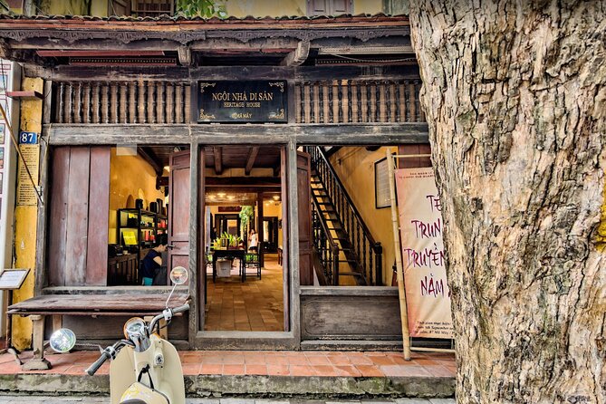 Timber shopfront of Heritage House at 87 Ma May, its sign reading Ngoi Nha Di San