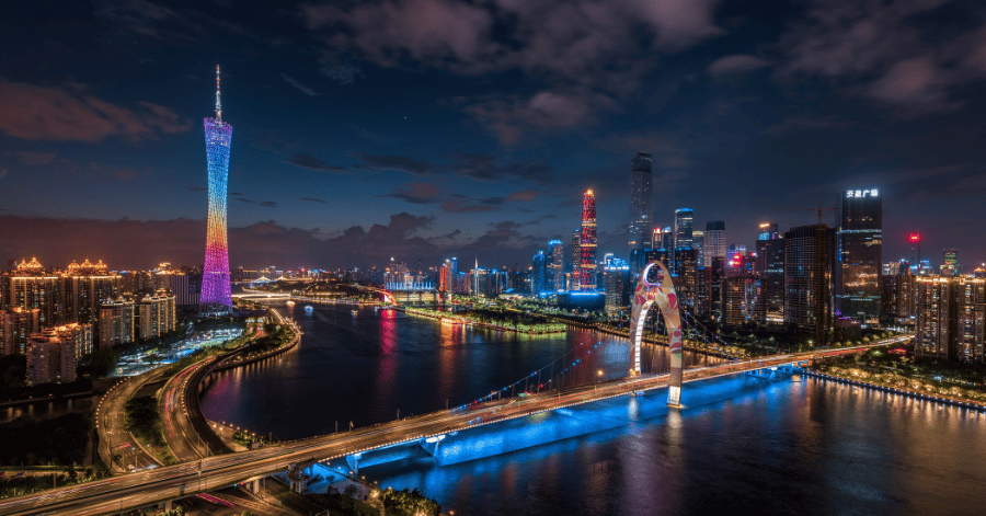 Guangzhou's night skyline with the illuminated Canton Tower and Liede Bridge over the Pearl River