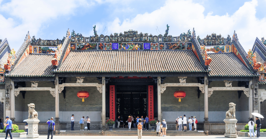 The ornate carved roof ridges and grey-brick facade of the Chen Clan Ancestral Hall in Guangzhou