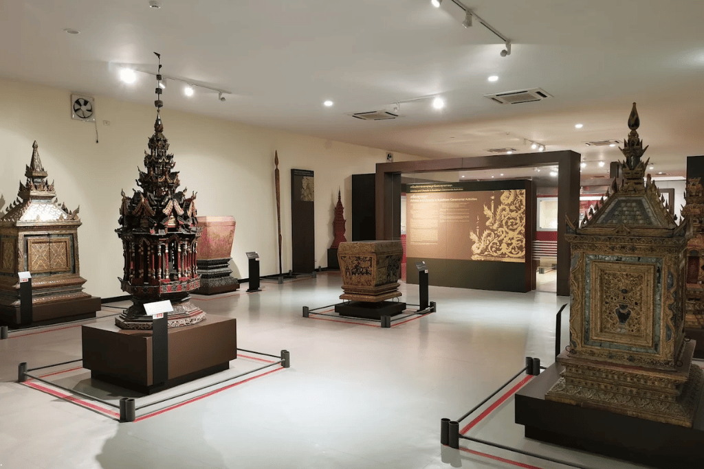 Gilded Lanna ceremonial artefacts on display in a gallery at the Chiang Mai National Museum
