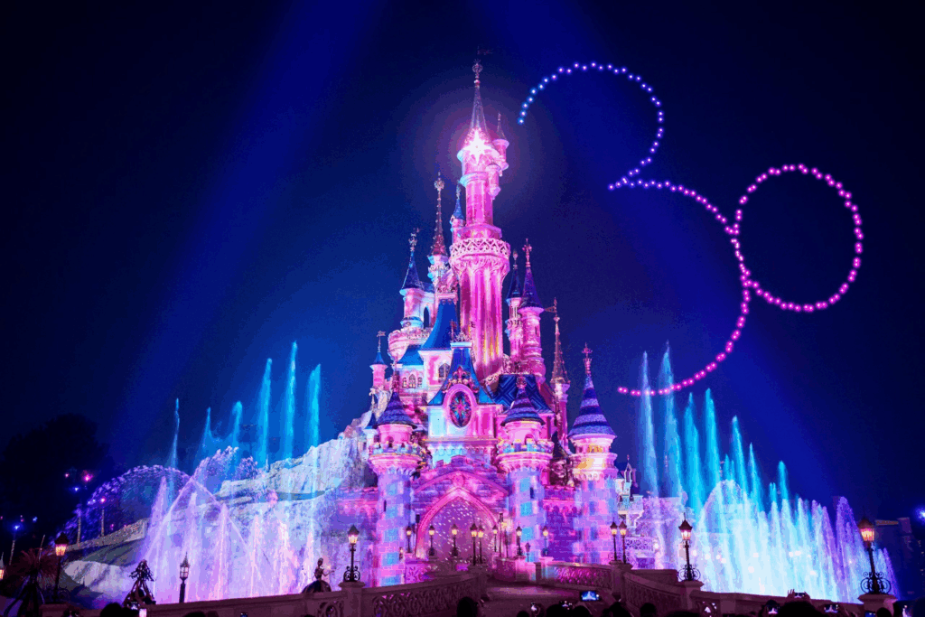 Disneyland Paris's castle centrepiece with visitors in the foreground